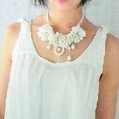 Crocheted or knitted flower necklace